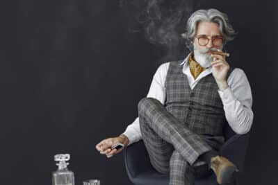 Cómo Elegir el Nombre de tu Marca: Guía Definitiva de Naming para Negocios que Quieren Arrasar en Internet (y en Google) 3 close up portrait grinning old fashioned man grandfather with cigar whiskey - Cómo Elegir el Nombre de tu Marca: Guía Definitiva de Naming para Negocios que Quieren Arrasar en Internet (y en Google)